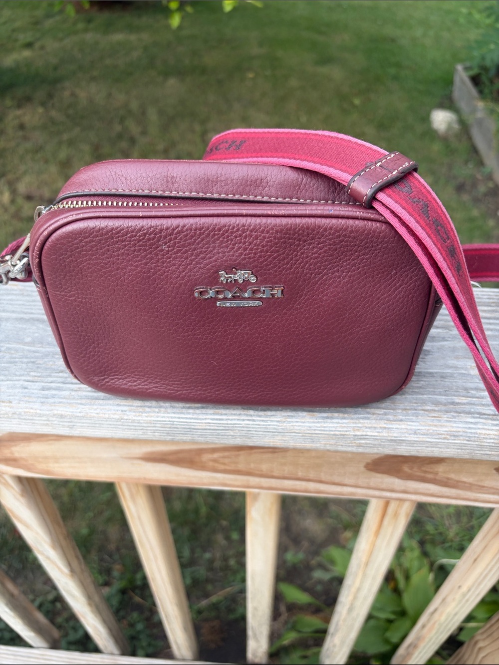 Coach Mini Jamie camera Pebble Leather Crossbody Bag in Wine with Pink Strap